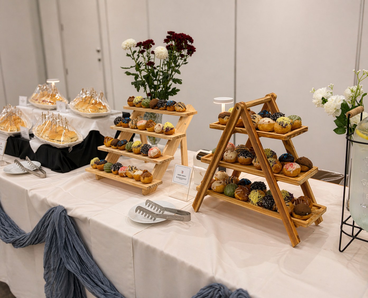 Baked salmon, fresh salads and warm bread on a banquet line beside a sunlit window